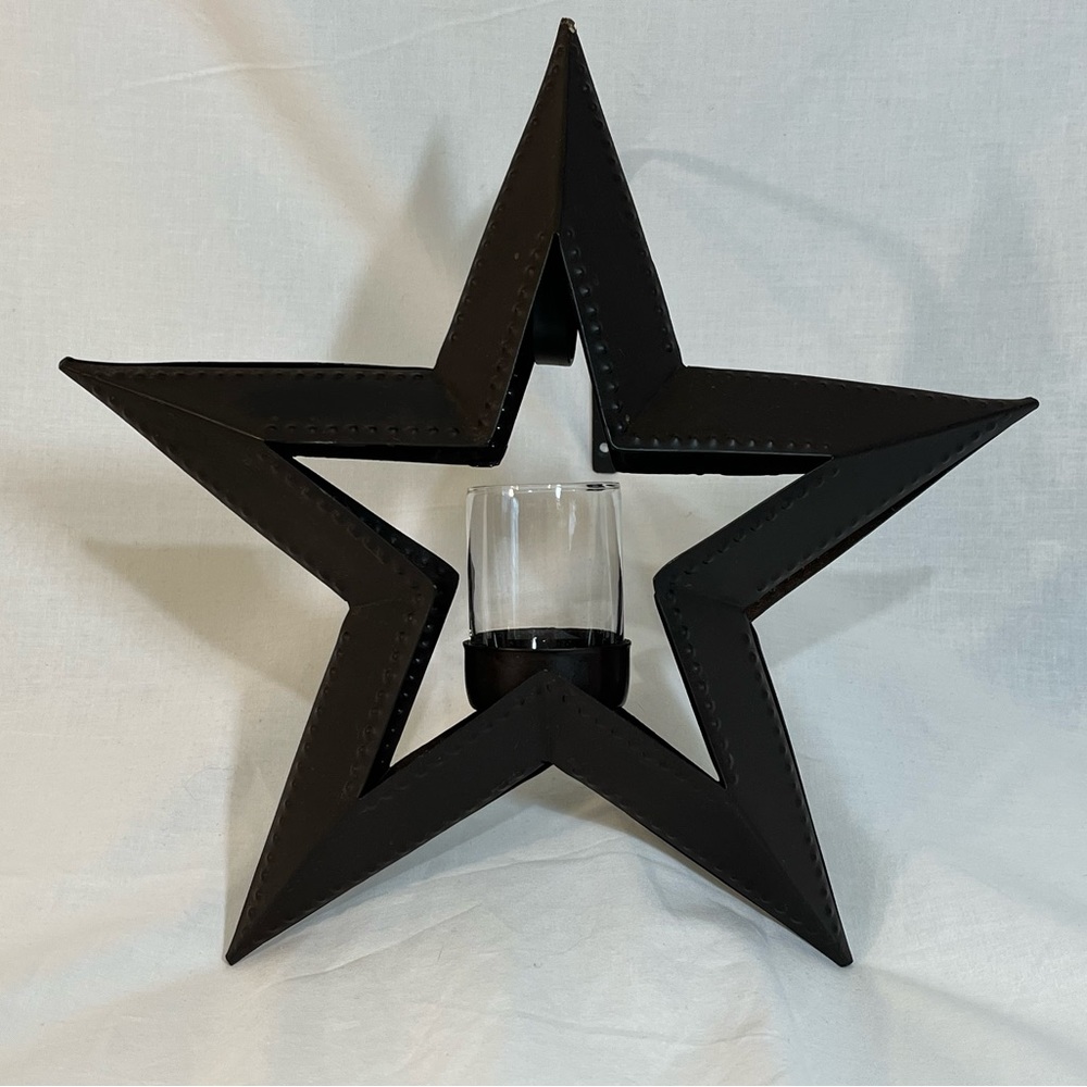 Hanging 12” wide candle holder w/ glass votive. Dark painted metal. Wall mount.